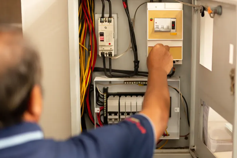Electrical panel being checked